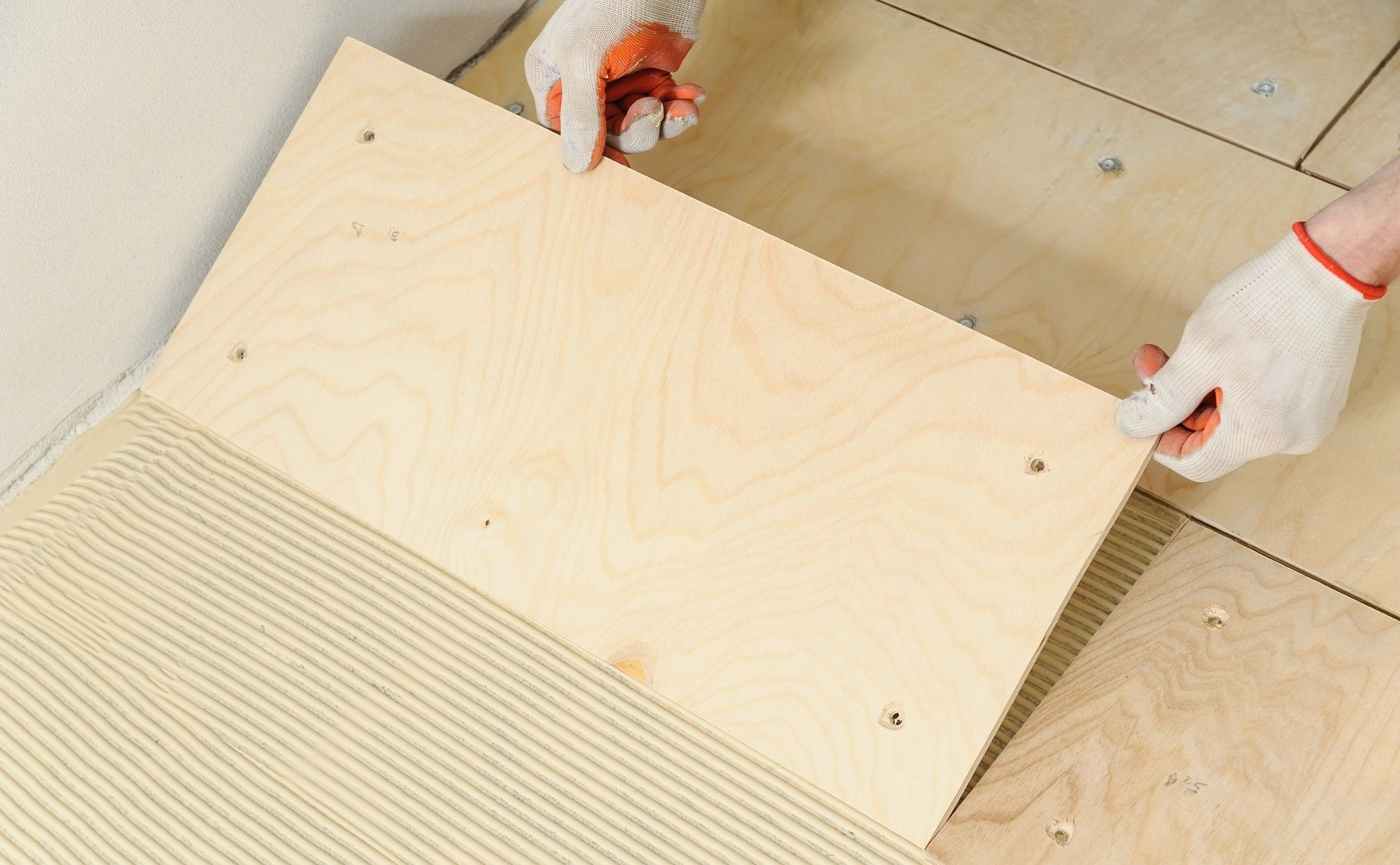 Laying down a wooden plyboard subfloor